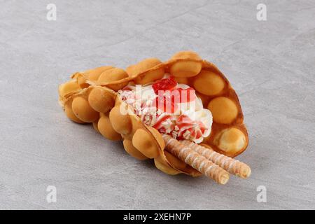 Delicious sweet bubble waffle on table Stock Photo