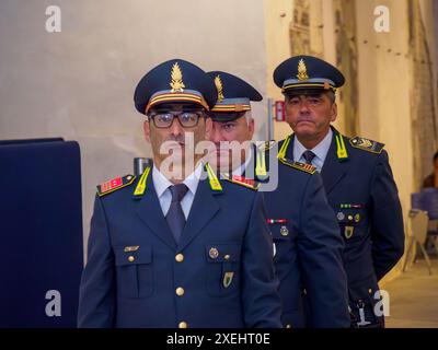 Cremona, Italy - June 26th 2024 Guardia di Finanza 250th Anniversary Event - Three italian police officers wearing uniform are standing in line Stock Photo