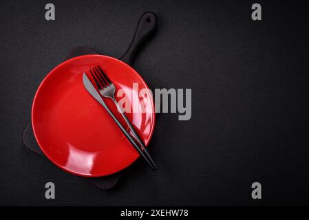 Bumpy empty ceramic plate on a textured concrete background Stock Photo ...