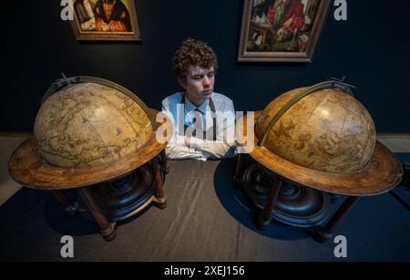 Christie's, London, UK. 28th June, 2024. Christie's Classic Week sale runs from 2-10 July spanning art from antiquity to the 20th century. Highlights include: Early pair of English table globes (c.1690), a terrestrial globe and a celestial globe, estimate £100,000-150,000. Credit: Malcolm Park/Alamy Live News Stock Photo