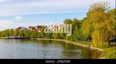 Elk, Poland - May 3, 2024: Panoramic view of Elk town with historic city center and waterfront promenade at Jezioro Elckie Lake in Mazuria lakeland Stock Photo