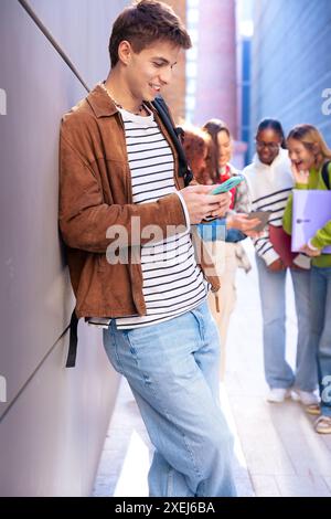 Young caucasian man browsing the internet using smartphone outdoors.Vertical Stock Photo