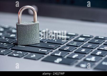 Close-up of closed lock on computer keyboard Stock Photo