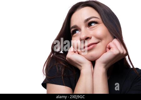 Young carefree woman with brown eyes wearing a black T-shirt, close-up portrait Stock Photo
