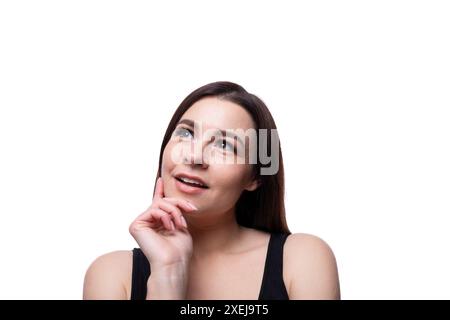 Casual young brunette woman daydreaming Stock Photo