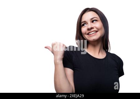 Young surprised woman looking to the side against a background with copy space Stock Photo