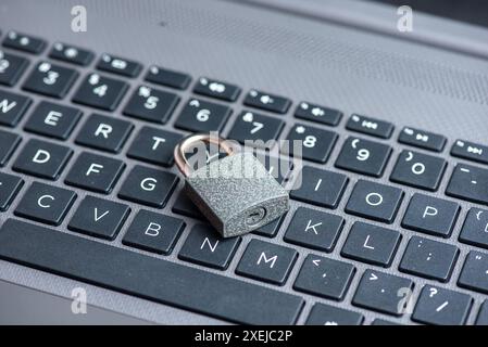 Close-up of closed lock on computer keyboard Stock Photo
