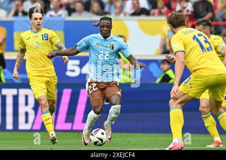 Jeremy Doku (22) of Belgium and Mykola Shaparenko (19) of Ukraine ...