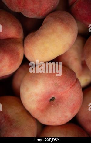box of small, ripe, peaches Stock Photo