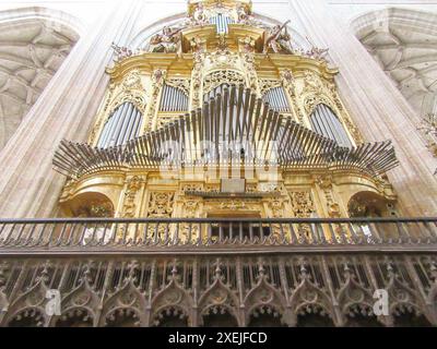 Ornate golden pipe organ in Segovia Cathedral with intricate details Stock Photo