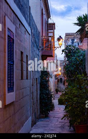 One of the small historic hidden streets in ancient city Vittoriosa - Birgu. Malta Stock Photo