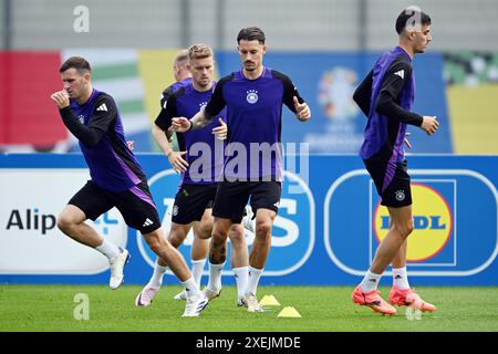 Herzogenaurach, Germany. 28th June, 2024. Soccer, UEFA Euro 2024, European Championship, final training session, Germany national team, ahead of the round of 16, Germany's Pascal Groß (l-r), Maximilian Mittelstädt, Robin Koch and Kai Havertz in action during team training. Credit: Federico Gambarini/dpa/Alamy Live News Stock Photo