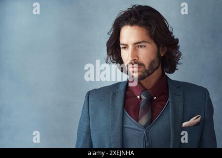 Thinking, businessman and serious for fashion in studio on gray background for career growth. Male person, confidence and idea as entrepreneur with Stock Photo