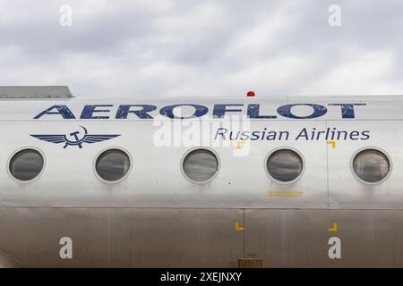 Riga, Latvia - June 1, 2023: Aeroflot Russian Airlines logo and title on the fuselage of an passenger airplane, retired aeroplane in a bad shape Stock Photo