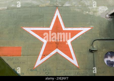 Identification mark of the Air Force of the Russian Federation, a five-pointed red star, bordered by a white stripe on an old mi Stock Photo