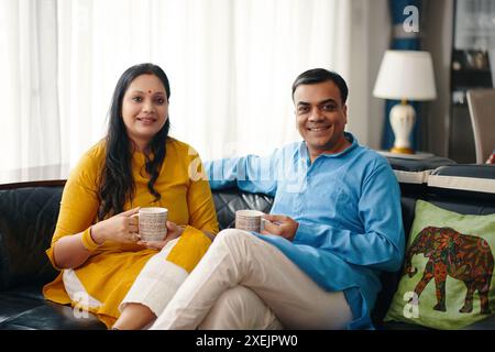 Happy Indian Couple Drinking Tea Stock Photo