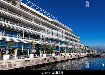 Monte Carlo, Monaco - December 26, 2023: Yacht club of Monaco in Monte Carlo Harbour, French Riviera, Cote d'Azur Stock Photo