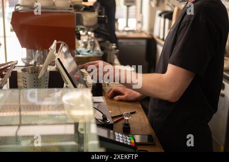 Barista faceless make coffee latte art with espresso machine in cafe  Stock Photo