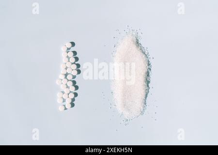 Sugar and sweetener scattered on a blue background Stock Photo