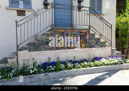 Ornate and colourful ceramic tiles on the steps leading up to a house on Isola Bella one of the Borromean Islands of Lake Maggiore in Northern Italy Stock Photo