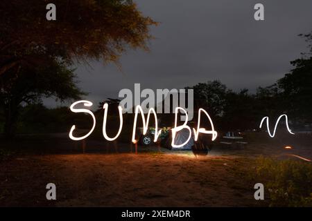 Light writing 'Sumba' at dark on a coastal beach, Pantai Puru Kambera, in East Nusa Tengara, Indonesia Stock Photo