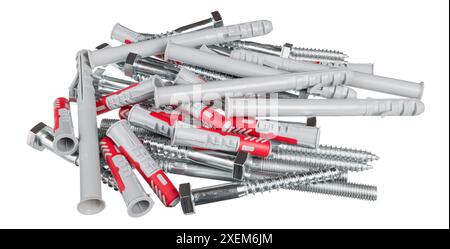 Pile of various plastic wall plugs or steel bolts isolated on white background. Different fasteners as expansion inserts or metal screws for anchoring. Stock Photo