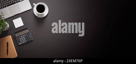 Office desk top view. Paperwork with laptop and coffee on black background Stock Photo