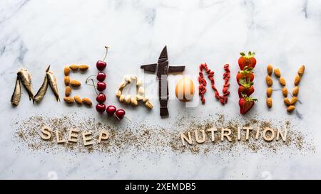 Above view of the word melatonin made from foods that contain the nutrient. Stock Photo