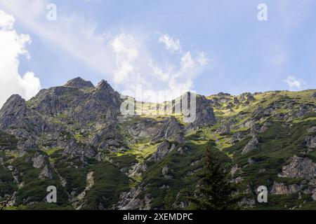 Beautiful, majestic mountains mesmerize and attract with their power against the blue sky. Stock Photo