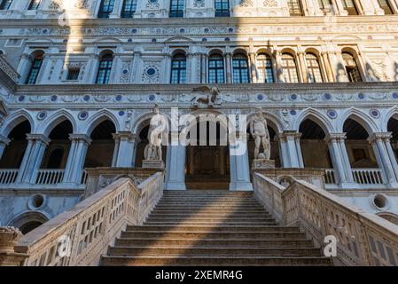 View of the Giant's Staircase (Scala dei Giganti) with marble statues of Mars and Neptune by Sansovino at Doge's Palace (Palazzo Ducale) in Venice Stock Photo