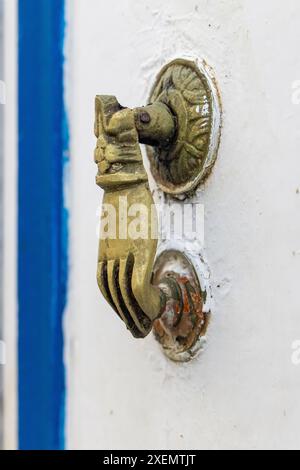 Hammamet, Nabeul, Tunisia. Hand shaped brass door knocker. Stock Photo