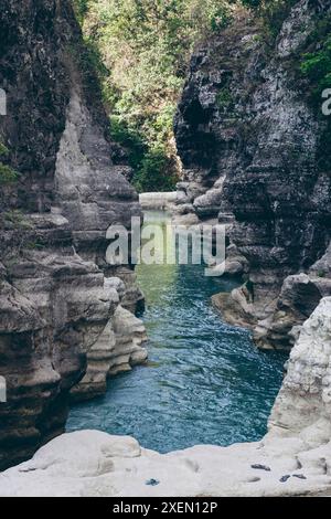 Tranquil water flows through a gorge at Air Terjun Tanggedu, Indonesia; Ndapayami, Kanatang, East Sumba Regency, East Nusa Tenggara, Indonesia Stock Photo