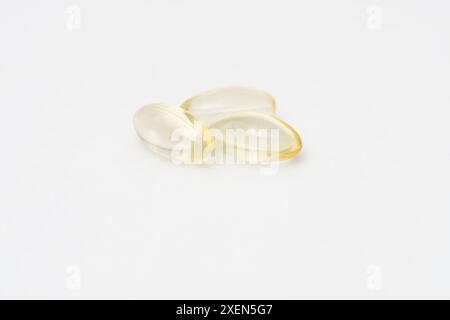 Close up of oil filled capsules (soft gel) suitable for presenting food supplements: fish oil, omega 3, omega 6, omega 9, vitamin A, vitamin D, D3, E Stock Photo