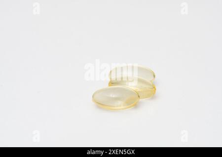 Close up of oil filled capsules (soft gel) suitable for presenting food supplements: fish oil, omega 3, omega 6, omega 9, vitamin A, vitamin D, D3, E Stock Photo