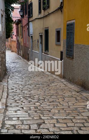 Cobblestone street in the old town of Rovinj, Croatia; Rovinj, Istria County, Croatia Stock Photo