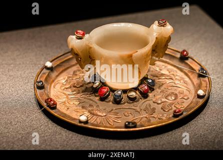 The Ming Dynasty cultural relics of Wuhan Museum, white jade wine glasses placed on gold trays Stock Photo