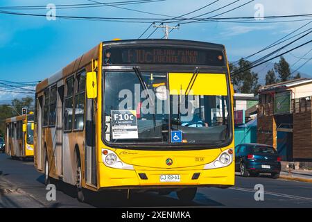 Santiago, Chile - October 26 2021: A public transport Transantiago, or Red Metropolitana de Movilidad, bus doing route F10c Stock Photo