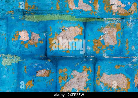 Concrete Broken Wall Background With Old Crumbling Square Tiles On Light Blue Stucco Stock Photo
