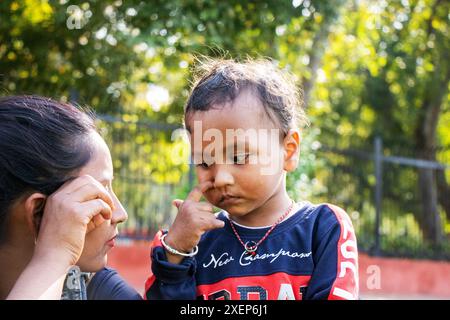 Indian kid playing in the outdoor park Stock Photo