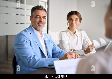 Happy business people executive team working together at group meeting. Stock Photo