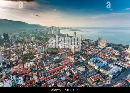 Stunning views of the city and Malacca Strait at sunset,from the rooftop of George Town's tallest building and prominent landmark,looking north-east. Stock Photo