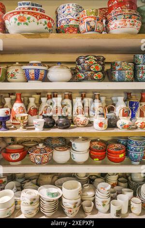 Hoi An, Vietnam - 8 Feb, 2024: Traditional Vietnamese ceramic bowls displayed for sale in a shop in Hoi An Old Quarter Stock Photo