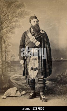 Older Man with a beard in full Highland dress in an Edinburgh studio. Stock Photo