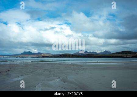 View from a deserted Mellon Udrigle beach in the Scottish Highlands. The hills surrounding Ullapool lay in the distance. Image uses travel, nc500 Stock Photo