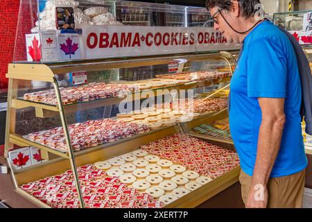 Ottawa, ON, Canada-June 12, 2024:  Man looking at display of Obama cookies for sale in Byward Market commemorating a visit by President Obama in 2009. Stock Photo