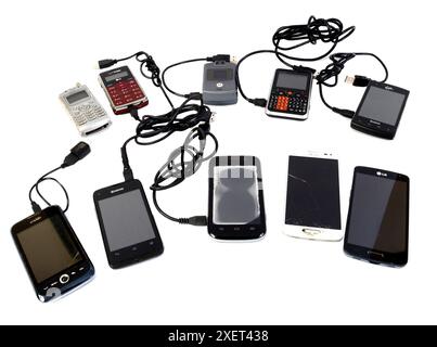 Maryville, Tennessee, United States – June 27, 2024: Horizontal close-up shot of 10 different phones curved in two rows of five on a white background. Stock Photo