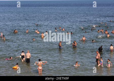 Odessa, Ukraine. 29th June, 2024. People relax by the water and swim in the water at Dolphin Beach. Hot summer day near the Black Sea. People escape the heat through relaxing by the water. (Photo by Viacheslav Onyshchenko/SOPA Images/Sipa USA) Credit: Sipa USA/Alamy Live News Stock Photo