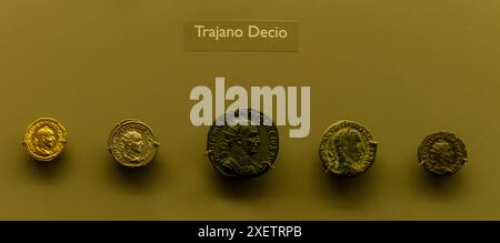 Collection of Roman coins featuring Emperor Trajan Decius. Display showcases detailed portraits and inscriptions of the ancient Roman ruler. Stock Photo