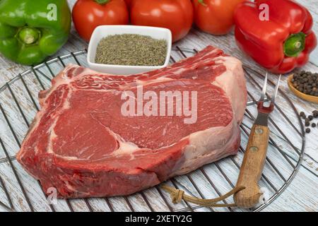 raw beef rib, close-up, on a barbecue grill Stock Photo