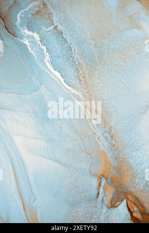 A close-up abstract image showcasing swirling patterns in shades of blue and white. The textures resemble water or ink, creating a dreamy, ethereal Stock Photo
